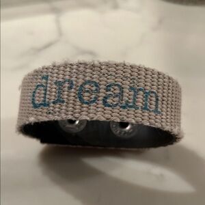 Recycled fire hose bracelet.  Fabric with dream saying.  adjustable snap closure